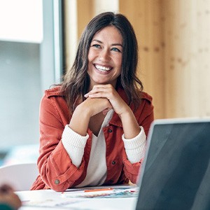Woman smiling during work meeting at office