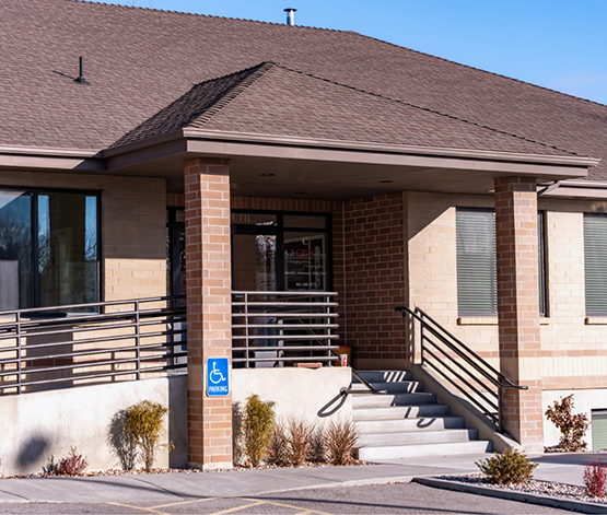 Short staircase leading to the front door of dental office in West Jordan