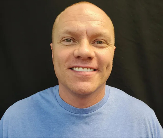 Man smiling brightly with whiter teeth