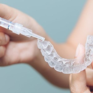 Patient uses take-home whitening kit