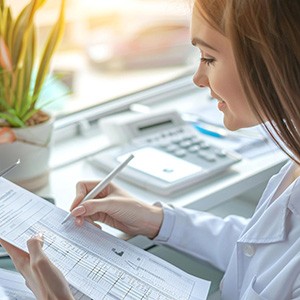 Person reviewing payment paperwork